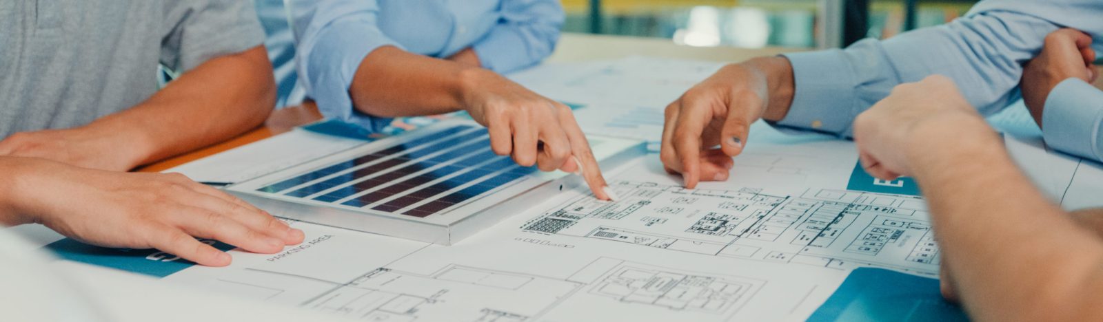 Closeup team of industrial engineers brainstorming of sustainability renewable energy working focused ESG environmental considerations in manufacturing factory. Sustainable manufacturing plant concept.